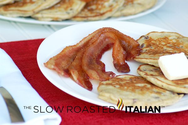 candied bacon on plate with pancakes