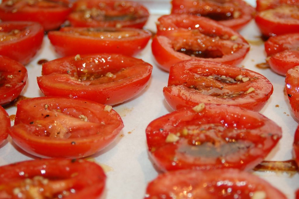 garden tomatoes on baking sheet