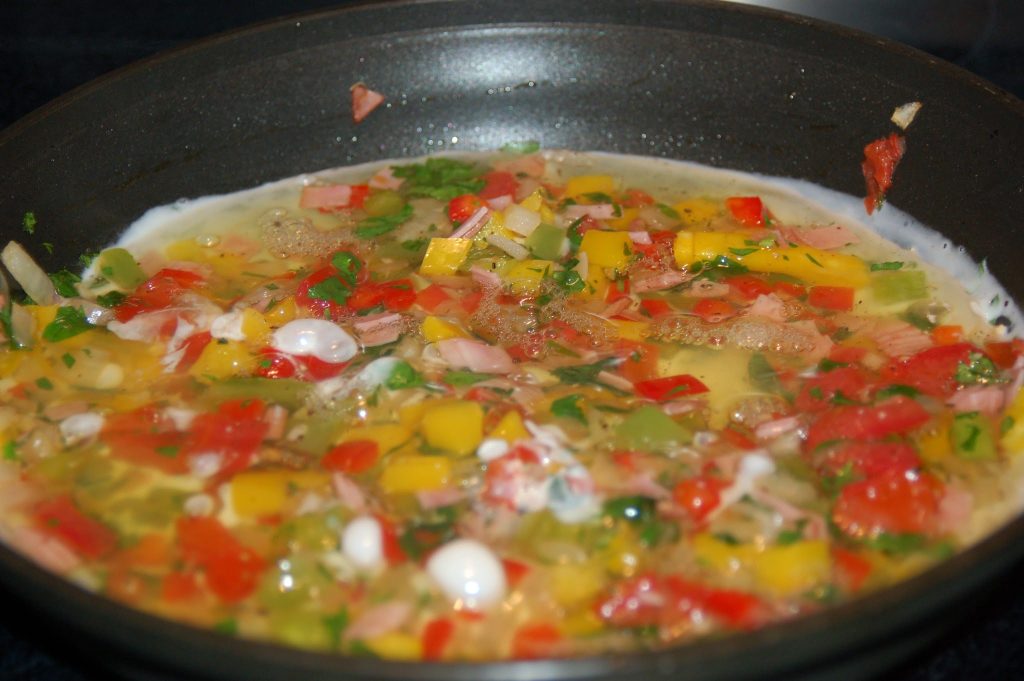 egg whites and southwest vegetables cooking in skillet for frittata recipe