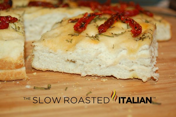 homemade focaccia bread with rosemary and tomatoes