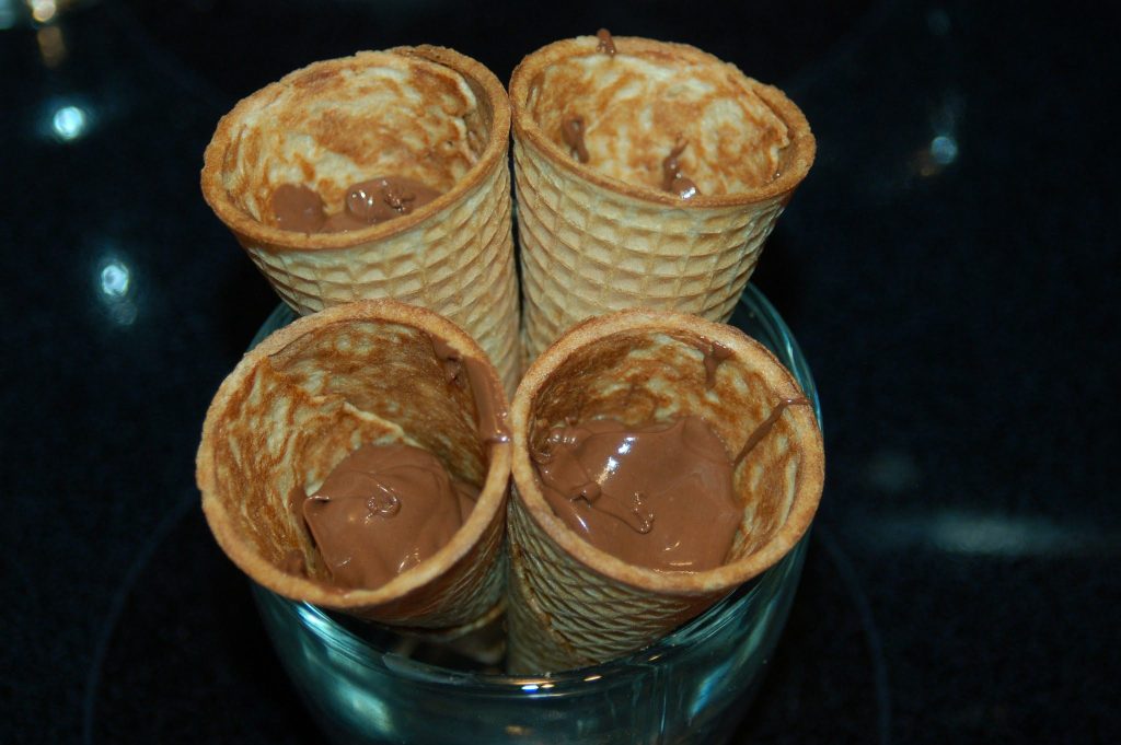 four ice cream cones filled with chocolate ganache