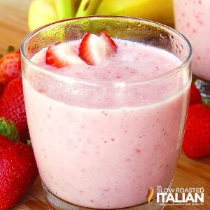 strawberry banana smoothie garnished with fresh strawberry