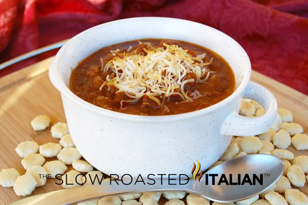 bowl of chili with shredded cheese on top