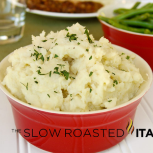 potato and cauliflower mash in a red bowl