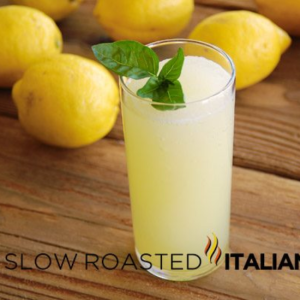 Glass of Perfectly Frozen Basil Lemonade with garnish leaves