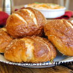 pretzel rolls on a white plate