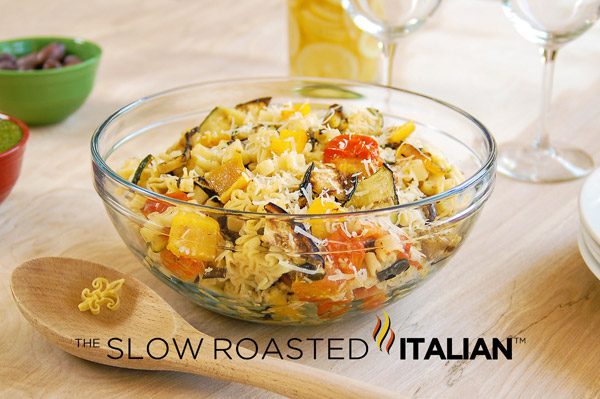 grilled veggie pasta salad in a glass bowl
