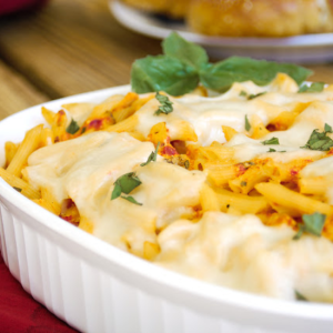 cheesy chicken pasta bake in casserole dish