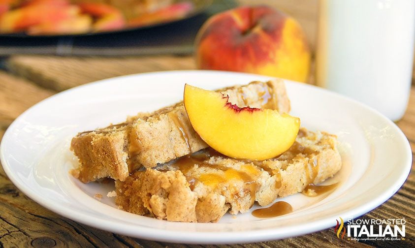 slice of peach pound cake on a plate with caramel sauce