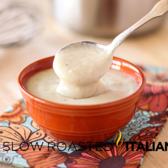 homemade cream of chicken soup in an orange bowl