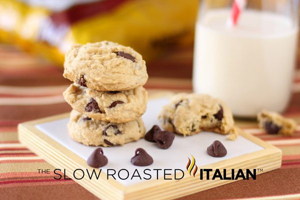 chewy chocolate chip cookies next to glass of milk