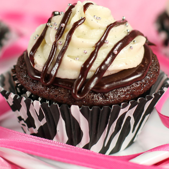 black and white cupcake with chocolate drizzle