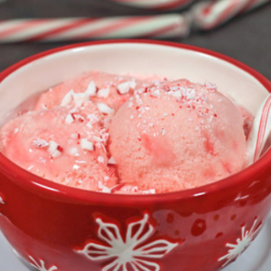 bowl of peppermint ice cream with candy cane