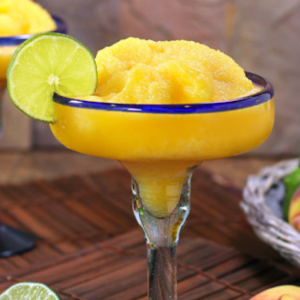 peach frozen margarita in glass