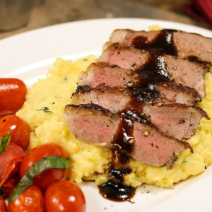 balsamic steak with polenta on a plate