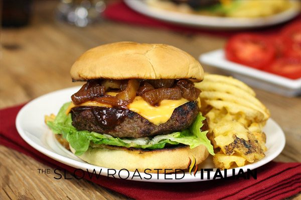 plated gourmet burger with bbq sauce and beer caramelized onions