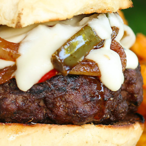 smoked provolone cheese sauce on a burger