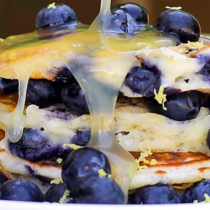 stack of homemade pancakes with fresh blueberries