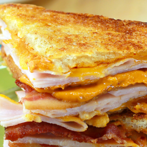 chipotle bacon monte cristo sandwiches stacked on plate