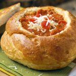 pepperoni pizza soup in bread bowls