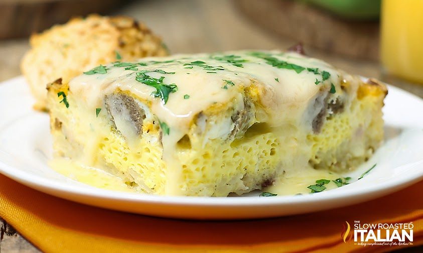 baked eggs with cheese and sausage on plate.