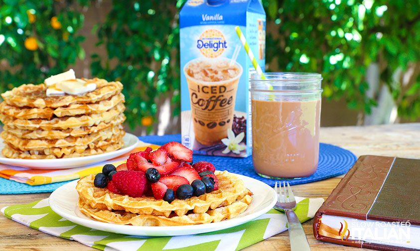 family breakfast table setting with waffles and iced coffee