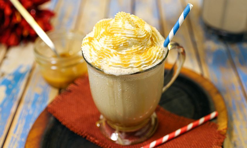 frozen coffee drink in glass with straw