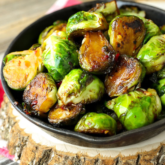 brussels sprouts with sweet chili sauce in a cast iron pan