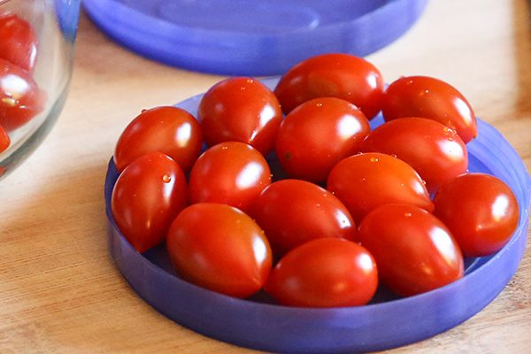 small tomatoes on blue plate