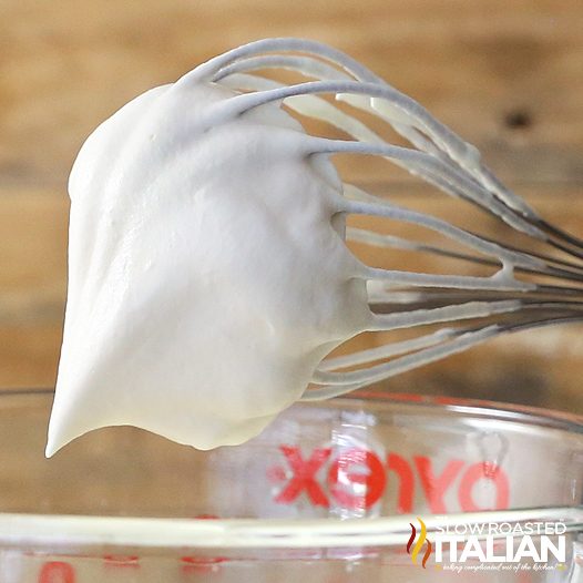 homemade whipped cream on a whisk.