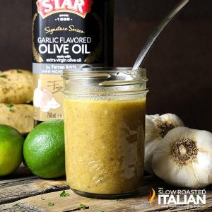 garlic-garlic lime marinade in a glass jar