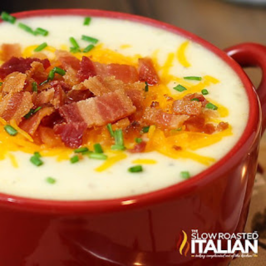 cheesy baked potato soup in red bowl