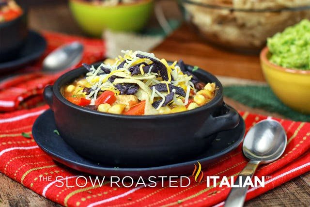 chicken tortilla soup in black bowl