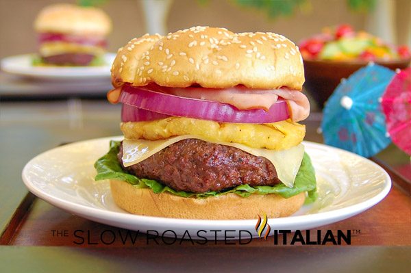 gourmet burger with hawaiian pineapple, onion, lettuce and cheese