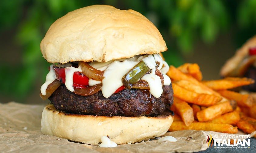 Gourmet Burger with sauteed peppers and onions plus smoked provolone cheese sauce