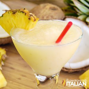classic pina colada in glass with straw