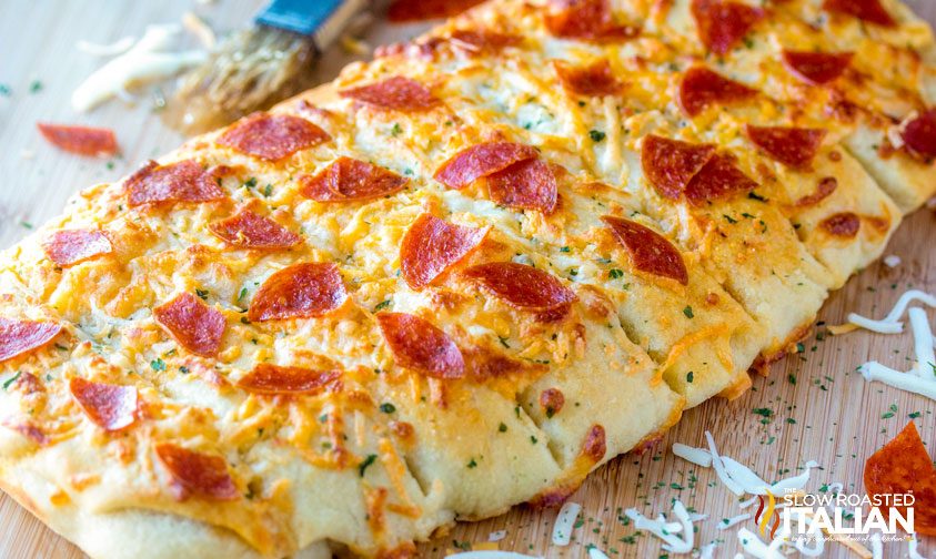 cheesy pepperoni pizza breadsticks on pan