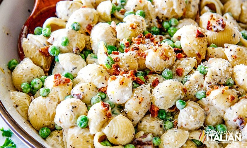 bowl of creamy pasta salad with peas and bacon
