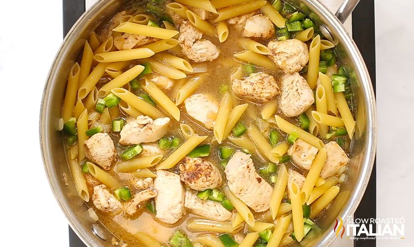 chicken cooking with pasta