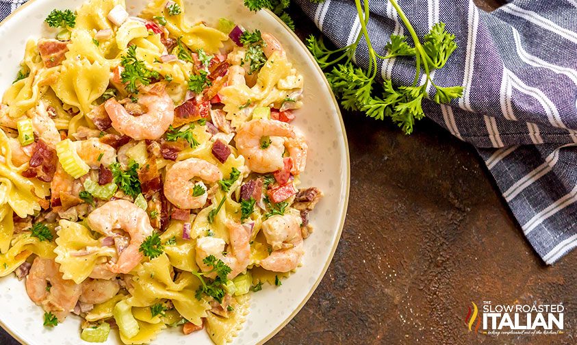 bacon shrimp pasta salad in a bowl on table
