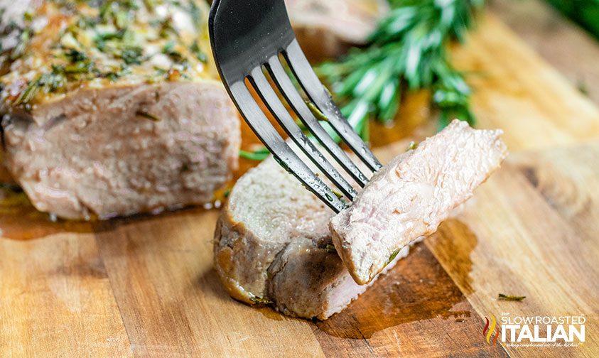 cutting herb roasted pork tenderloin