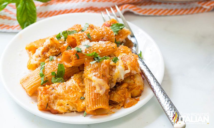 chicken rigatoni on white plate with fork