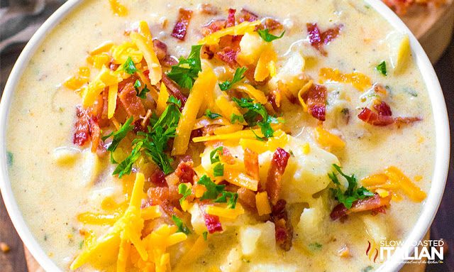 overhead: crockpot potato soup with shredded cheese and bacon
