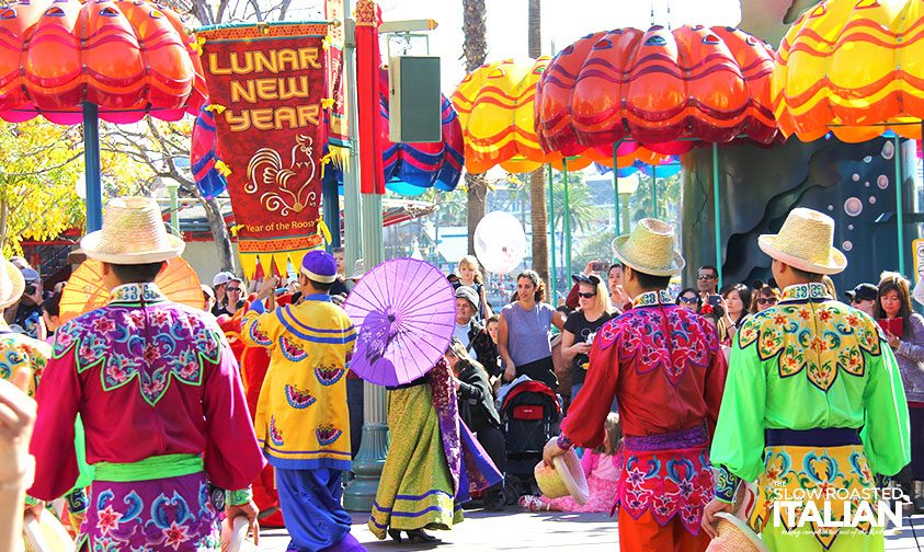 people dressed in traditional Asian costumes for lunar new year celebration