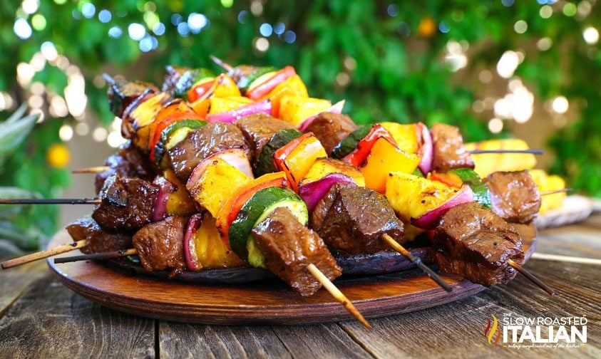 platter of beef and pineapple on skewers