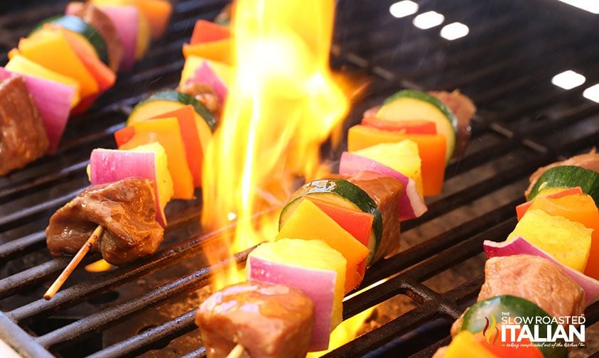 grilling meat and vegetables on gas grill