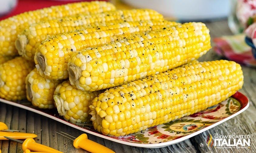 perfect corn on the cob stacked on a dish