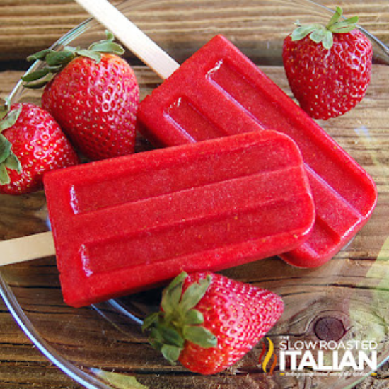 strawberry popsicles on plate with fresh strawberries