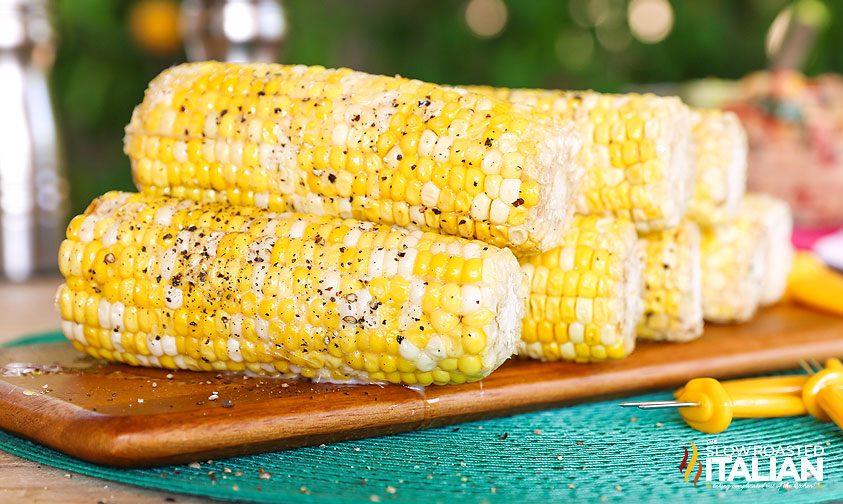 crock pot corn on the cob on cutting board