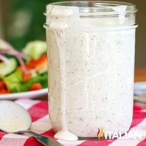buttermilk ranch salad dressing dripping from a jar